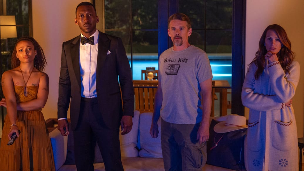 A photo including Myha’la as Ruth, Mahershala Ali as G.H., Ethan Hawke as Clay and Julia Roberts as Amanda in the film Leave the World Behind on Netflix