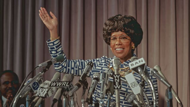 Regina King as Shirley Chisholm stands at a press conference in a still from ‘Shirley’