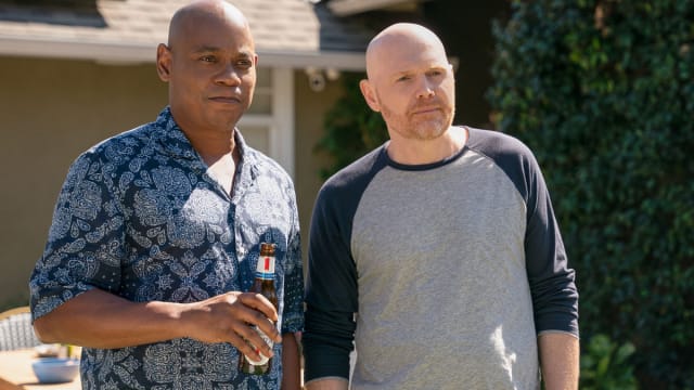Bokeem Woodbine and Bill Burr hold beers together.