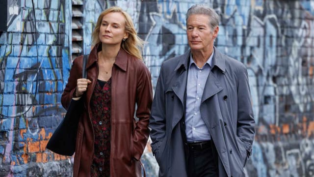 Diane Kruger and Richard Gere walk in a still from ‘Longing'