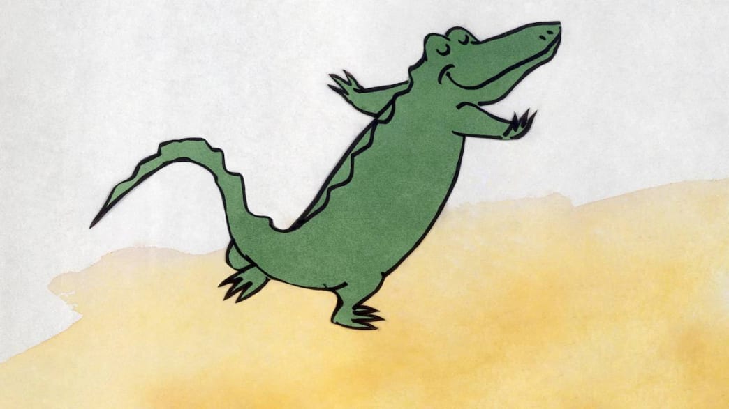 A crocodile stands on his hind legs, smiling.