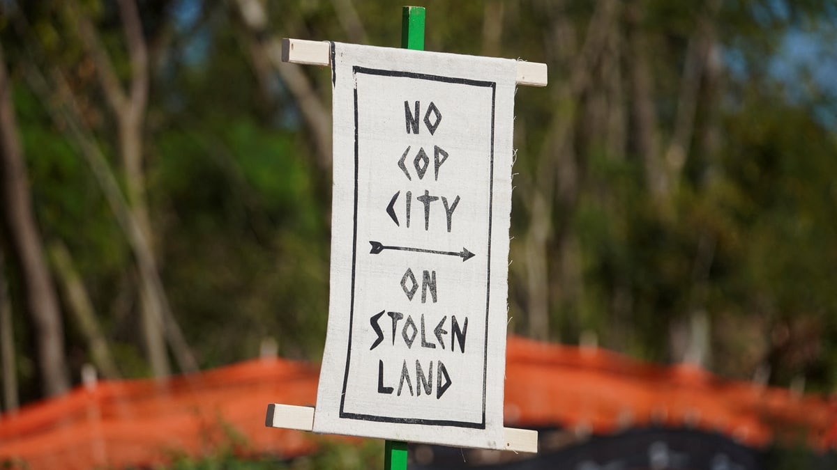 A sign is seen during a protest at the site of a proposed Atlanta police training center, derisively called "cop city."