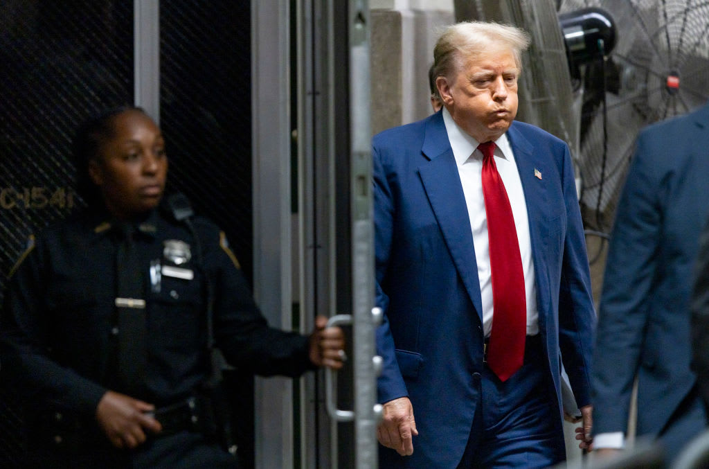 Former U.S. President Donald Trump returns to the courtroom following a break during his trial.
