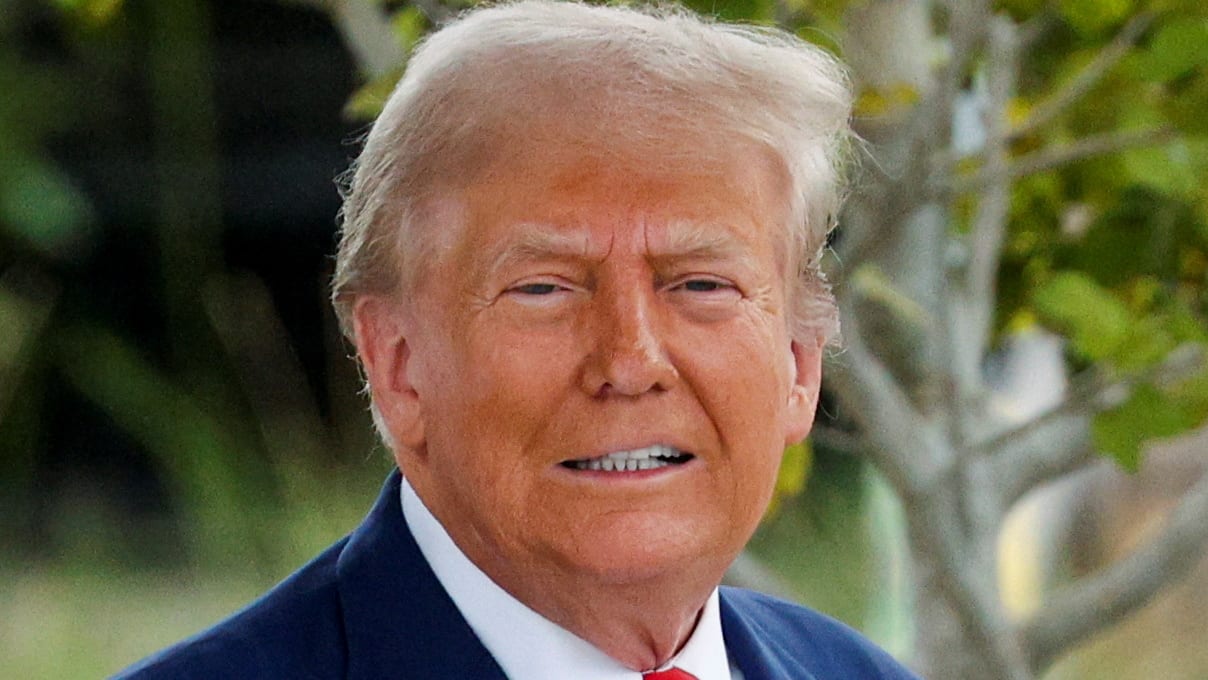 Republican presidential candidate and former U.S. President Donald Trump looks on as he leaves, after casting his ballot for early voting in Florida's primary election, in West Palm Beach, Florida, U.S. August 14, 2024.  