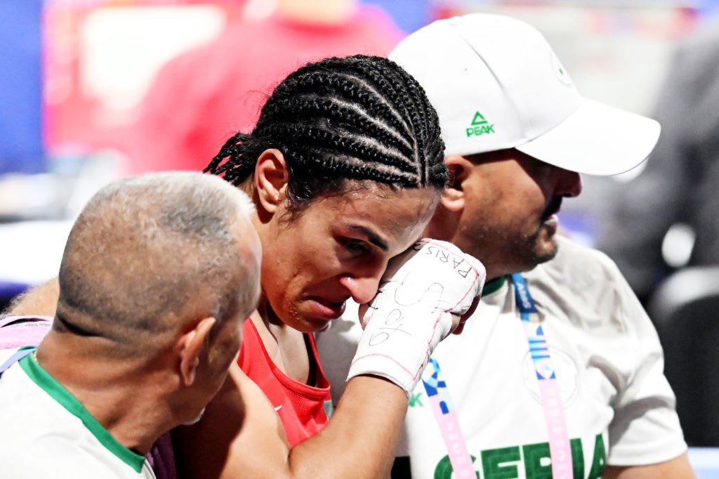 Welterweight Imane Khelif from Algeria wipes her face after a fight against Luca Anna Hamori from Hungary (not pictured).