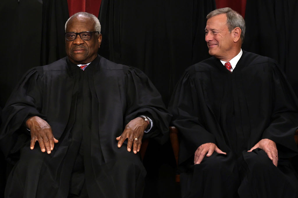 Supreme Court Justice Clarence Thomas and Chief Justice John Roberts.