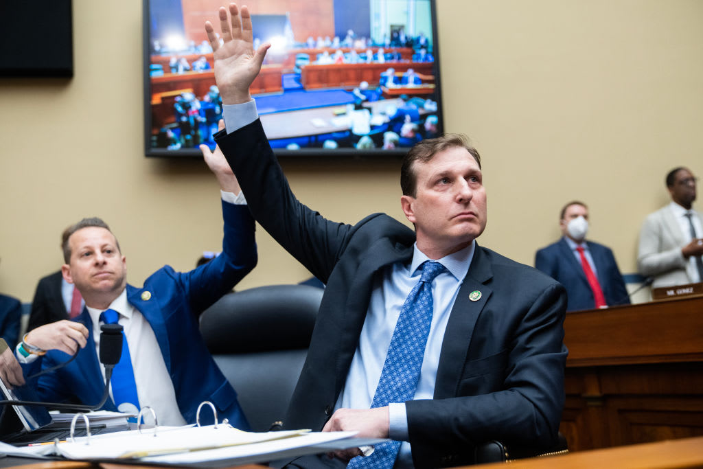 Reps. Jared Moskowitz (D-FL) left, and Dan Goldman (D-NY), raise their hands to indicate they want to hear testimony from Hunter Biden