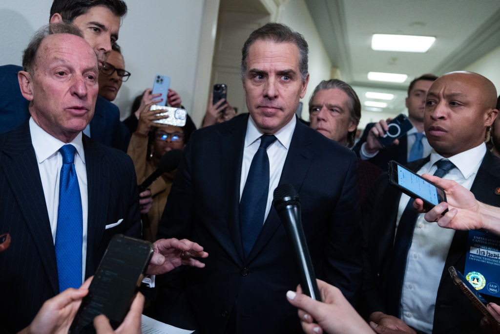 Hunter Biden, center, and his attorney Abbe Lowell, left, address the media after leaving the House Oversight and Accountability Committee markup