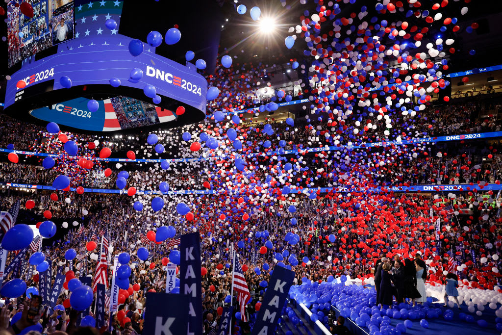 Balloons fall as Democratic presidential nominee, U.S. Vice President Kamala Harris, celebrates with her family during the final day of the Democratic National Convention.