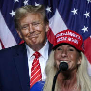 Rep. Marjorie Taylor Greene (R-GA) speaks alongside former US President and 2024 presidential hopeful Donald Trump at a campaign event in Rome, Georgia.