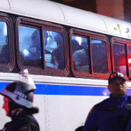 NYPD officers transport arrested students in a bus as they evict a building that had been barricaded by pro-Palestinian student protesters at Columbia University.