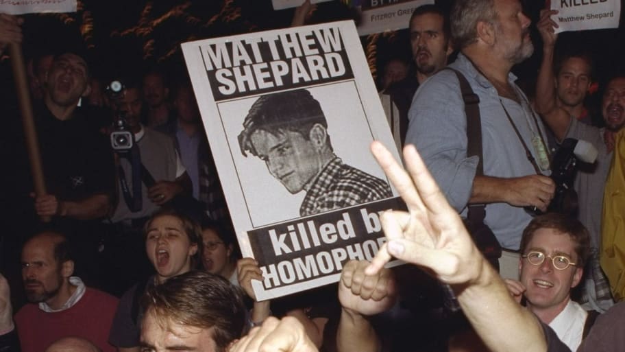 Demonstrators protest hate killing of gay student Matthew Shepard.