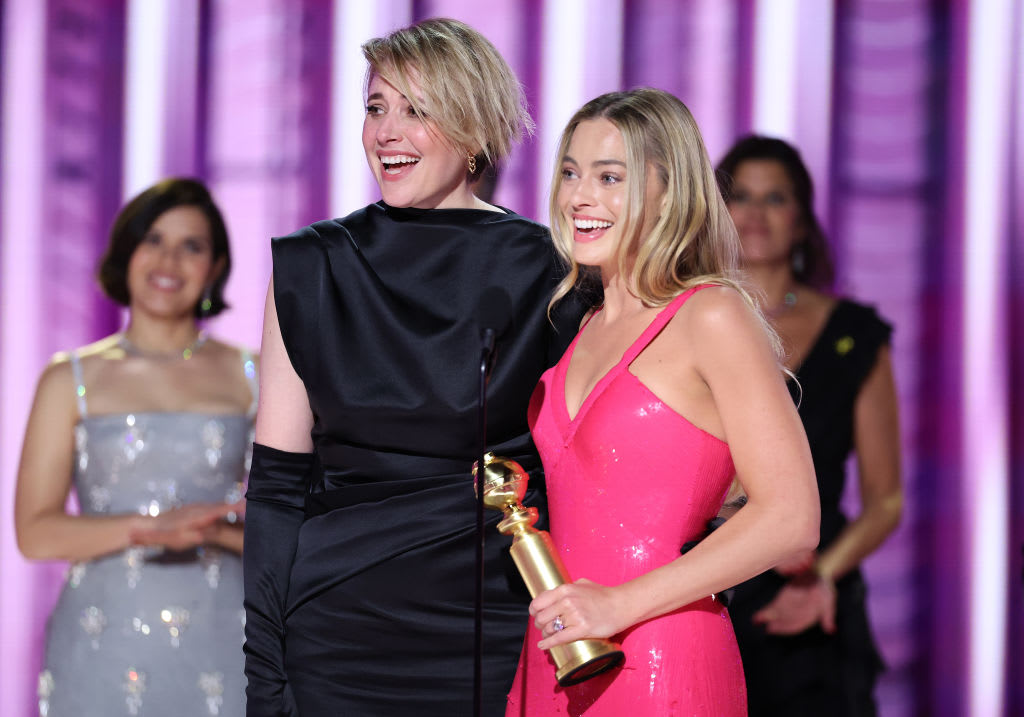 "Greta Gerwig and Margot Robbie accept the award for Cinematic and Box Office Achievement for \"Barbie\" at the 81st Golden Globe Awards held at the Beverly Hilton Hotel on January 7, 2024 in Beverly Hills, California