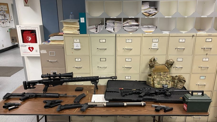 A cache of guns and tactical gear seized from a suspect in Los Angeles