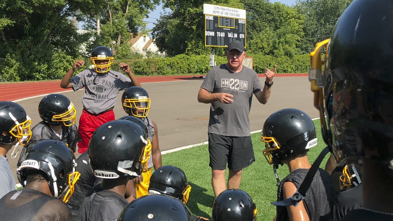 Tim Walz, then a candidate for Minnesota governor, gives a pep talk to football players at Como Park Senior High School in St. Paul in 2018. 