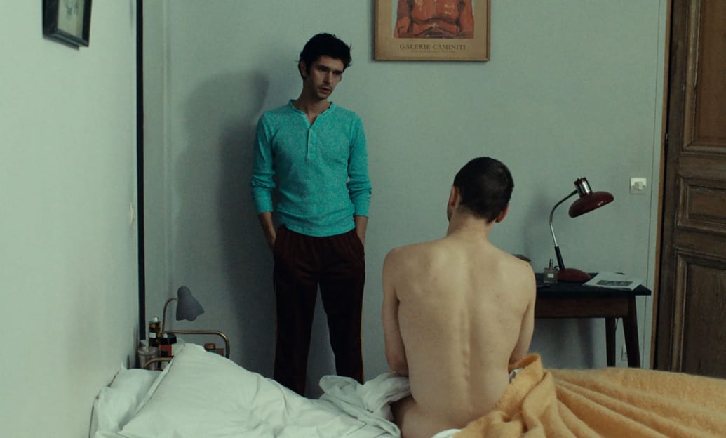 A still of ‘Passages’ with Ben Whishaw and Franz Rogowski sitting on a bed