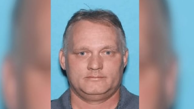 Mugshot of Robert Bowers staring forward with a blue background.