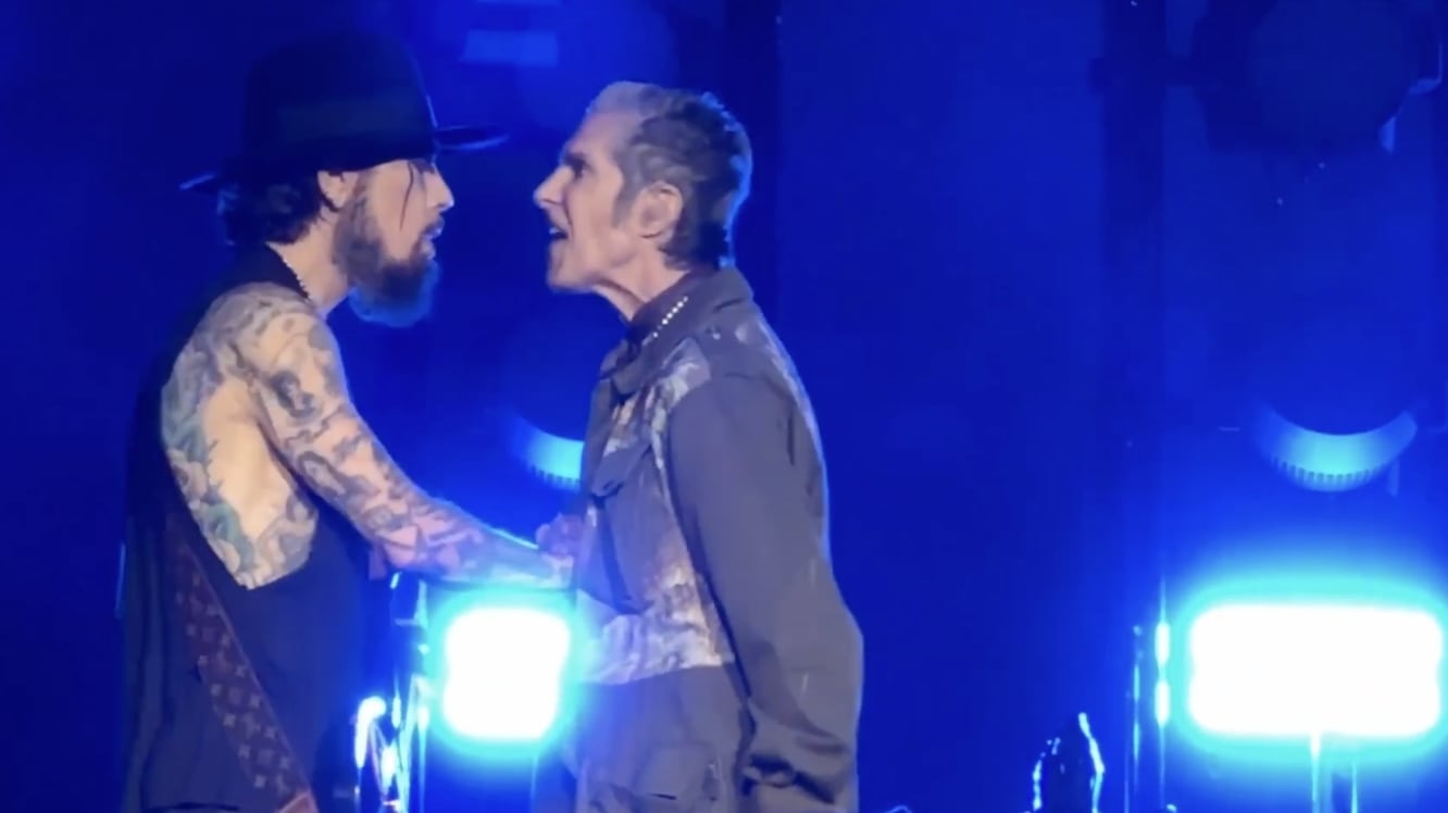 Jane’s Addiction frontman Perry Farrell punches guitarist Dave Navarro at their Boston concert.