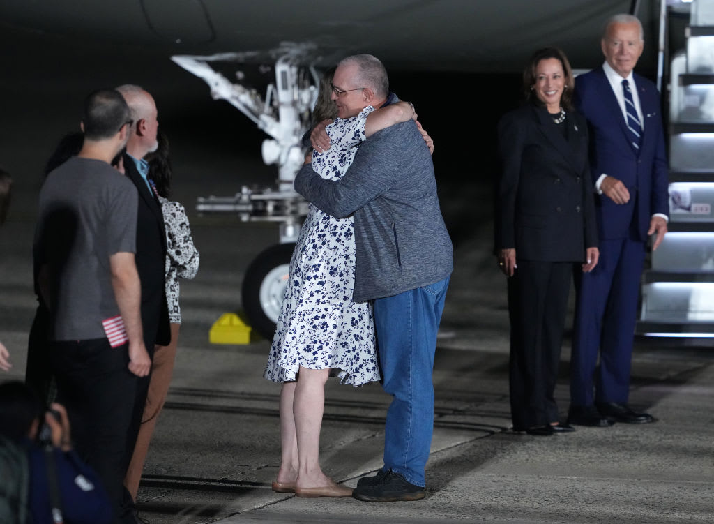 Freed prisoner Paul Whelan greets a family member after arriving at Joint Base Andrews on August 1, 2024 at Joint Base Andrews, Maryland.