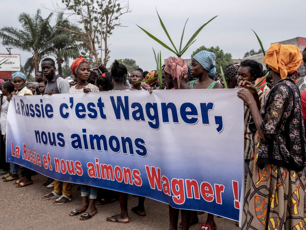 Protesters in the Central African Republic carry banners in support of Russia's Wagner group.