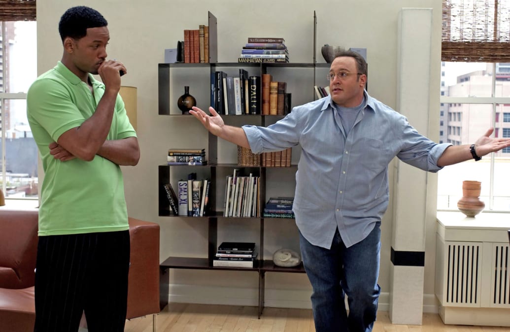 Will Smith and Kevin James stand next to each other in a still from ‘Hitch’
