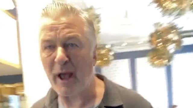 Alec Baldwin is confronted by performance artist Crackhead Barney, who repeatedly tells him to say ‘free Palestine’ in a New York coffee shop.