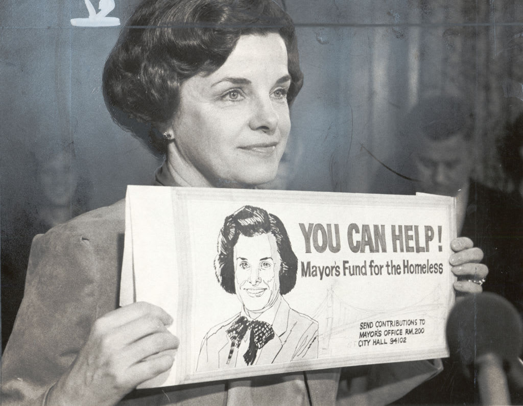 Dianne Feinstein holds a copy of a billboard to be placed in 20 locations throughout San Francisco on Jan. 20, 1983.