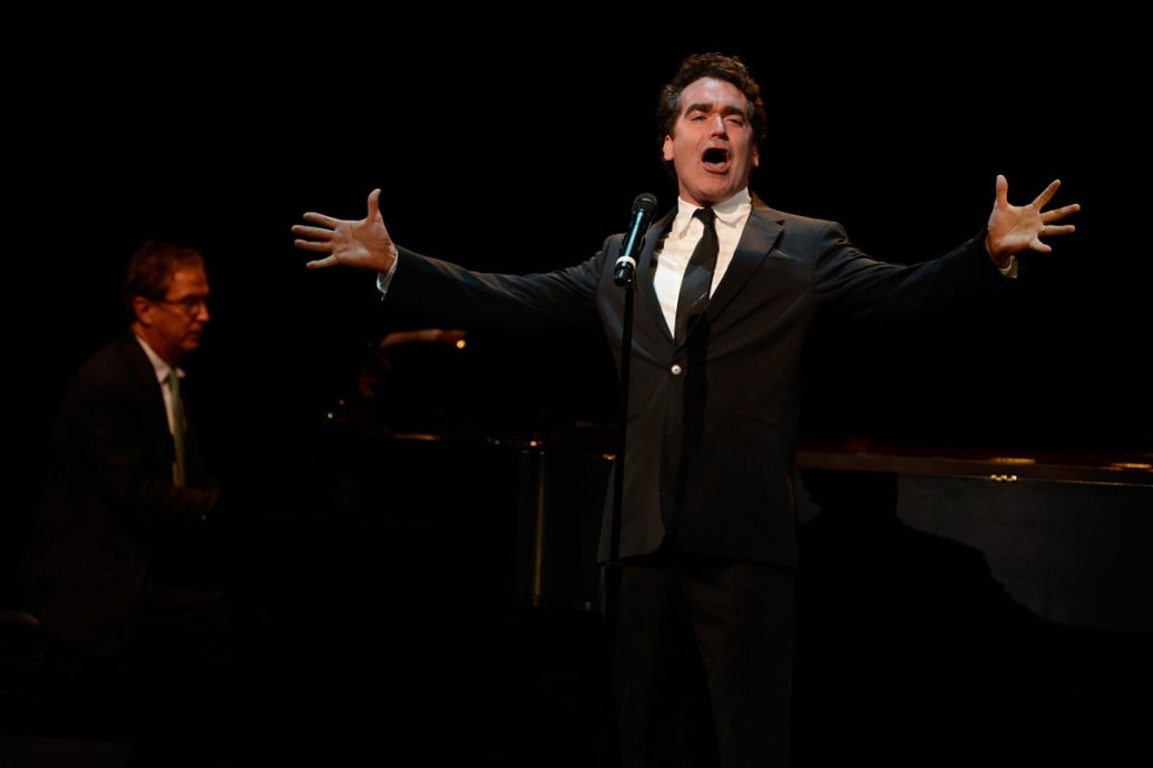 Pianist Rob Fisher and singer Brian D'Arcy James performs "At the Fountain" from Sweet Smell of Success on stage at the memorial of Marvin Hamlisch at Peter Jay Sharp Theater on September 18, 2012 in New York City.
