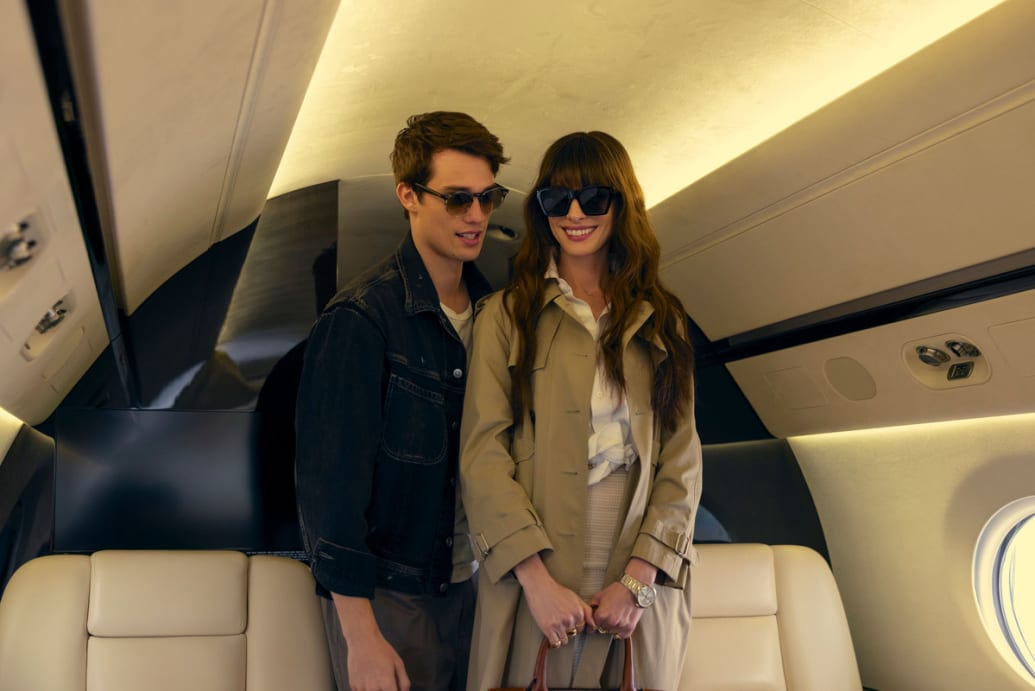 Anne Hathaway and Nicholas Galitzine on a plane in a still from ‘The Idea of You’