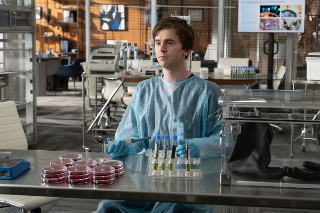 Freddie Highmore sits in a lab in a still from ‘The Good Doctor’
