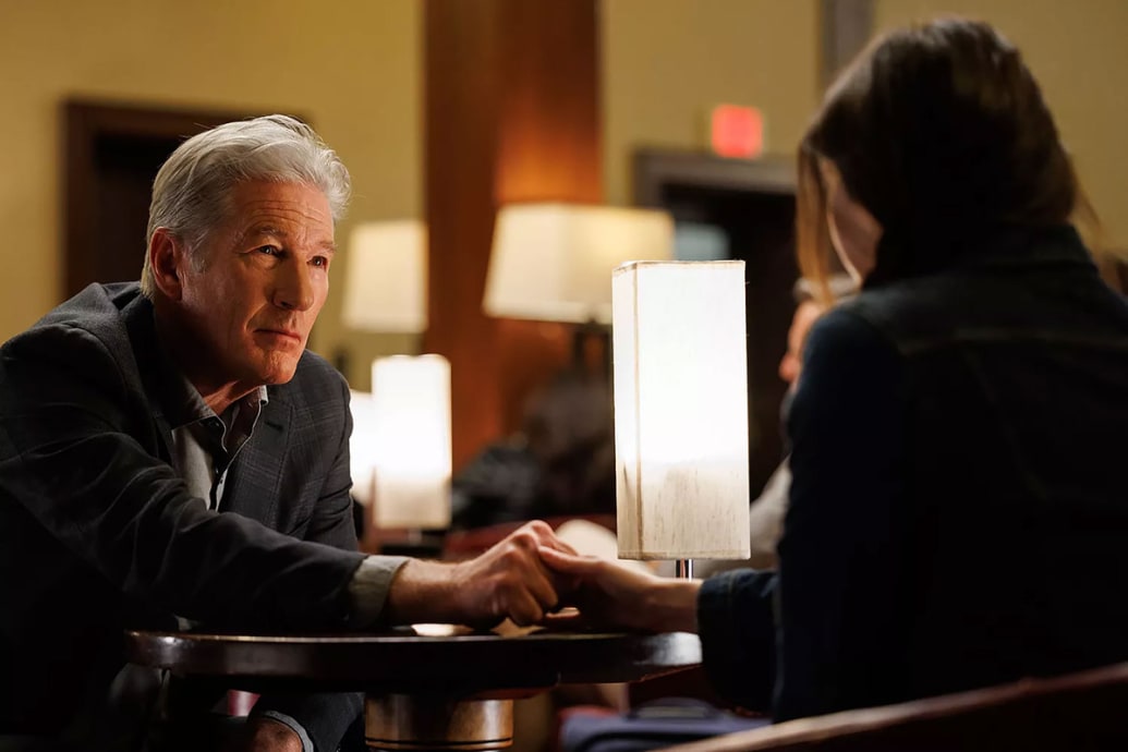 Richard Gere at a dinner table in a still from ‘Longing’