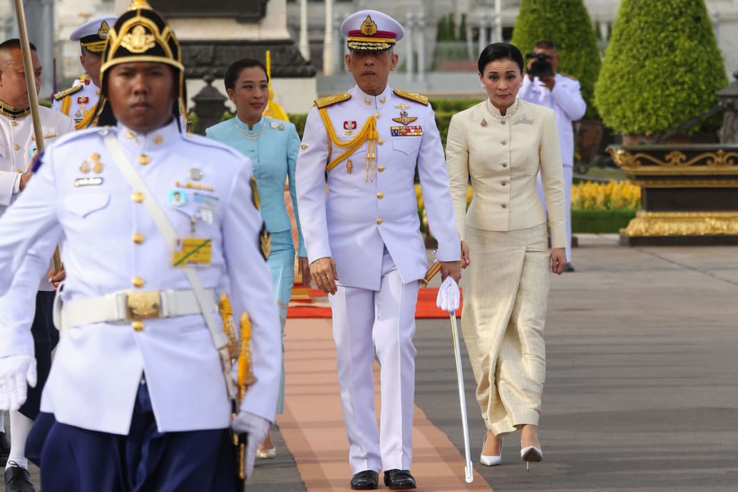 Thailand's King Maha Vajiralongkorn (C), Queen Suthida (R) and his daughter Princess Bajrakitiyabha (3rd L) in Bangkok.