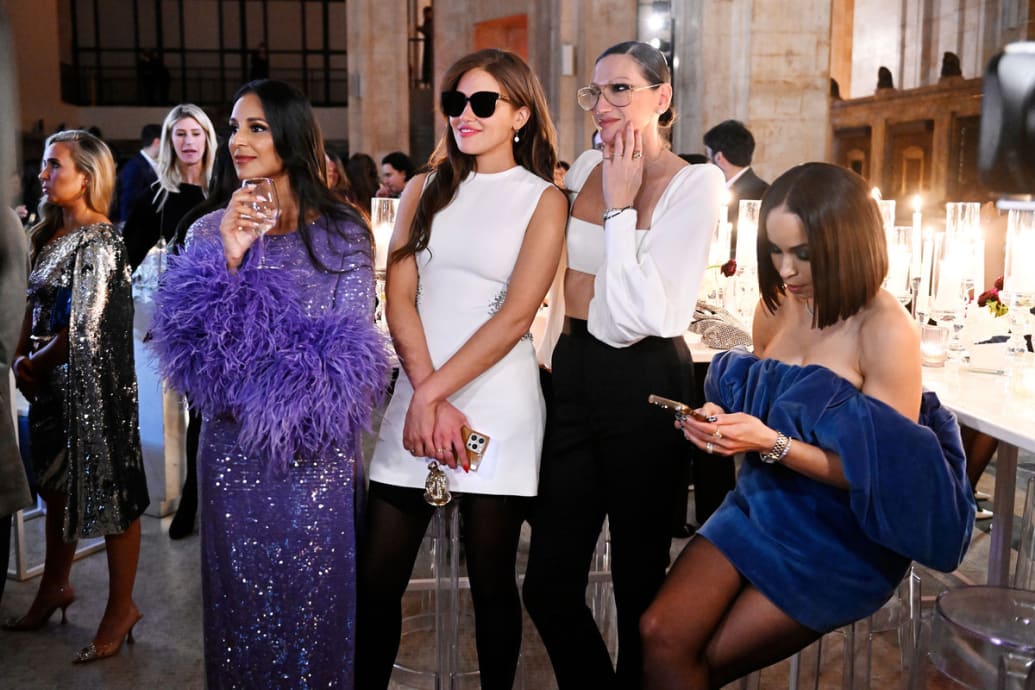 Jessel Taank, Brynn Whitfield, Jenna Lyons, and Sai De Silva stand at a party in a scene from The Real Housewives of New York