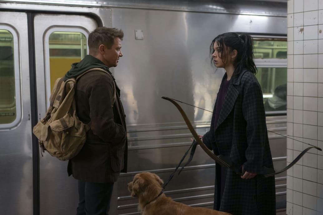 Jeremy Renner and Hailee Steinfeld look at each other on a subway platform in a still from ‘Hawkeye’