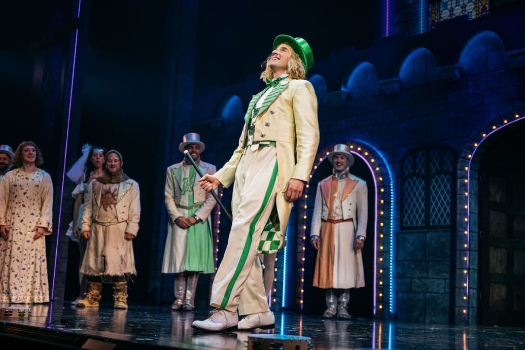Michael Urie dressed in a green and white suit in a picture from the Broadway musical ‘Spamalot.’
