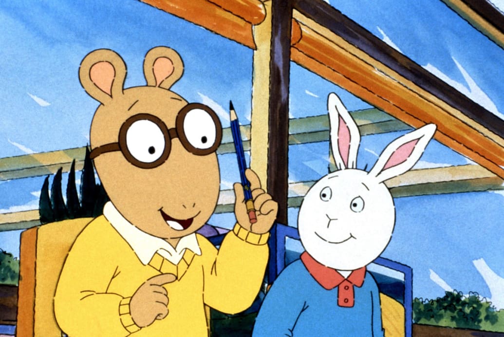 A still from the cartoon ‘Arthur’ with Arthur holding a pencil next to his friend Buster.