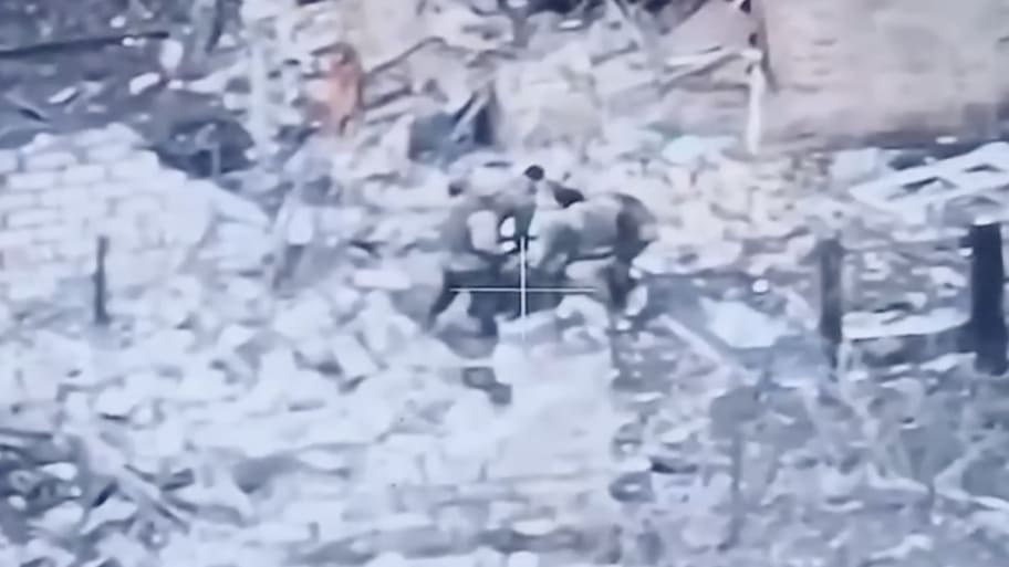Wagner mercenaries seen in drone footage allegedly beating their own commander. 