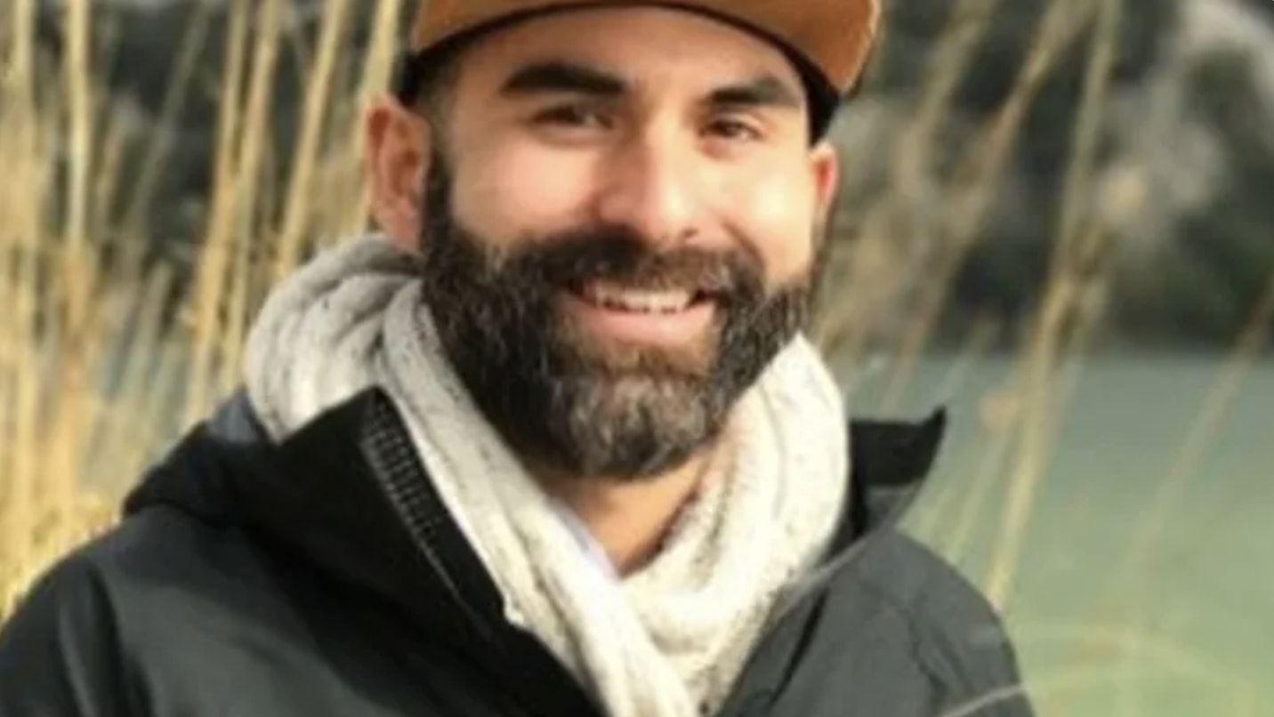 A photo of a smiling Ryan Furtado, wearing a baseball cap.