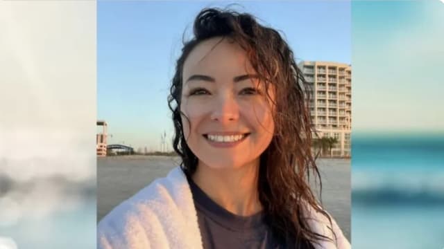 Mica Miller smiles in a selfie on the beach.