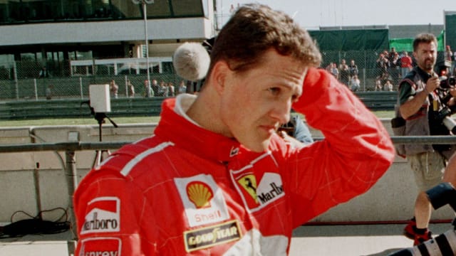 Formula One driver Michael Schumacher of Ferrari leaves the pit after a qualifying session for the Luxemburg Grand Prix, September 27, 1997.
