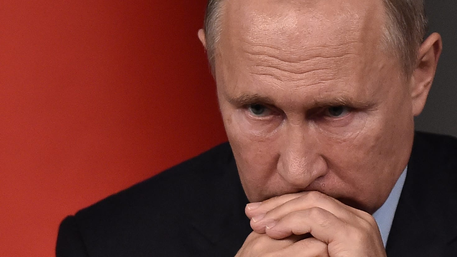 Russian President Vladimir Putin attends a conference.