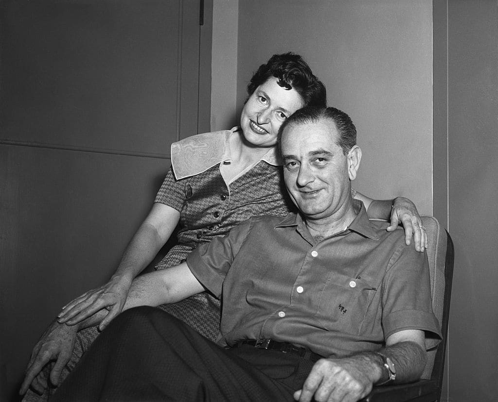 Lyndon Johnson and Lady Bird pose for photographers in 1955.