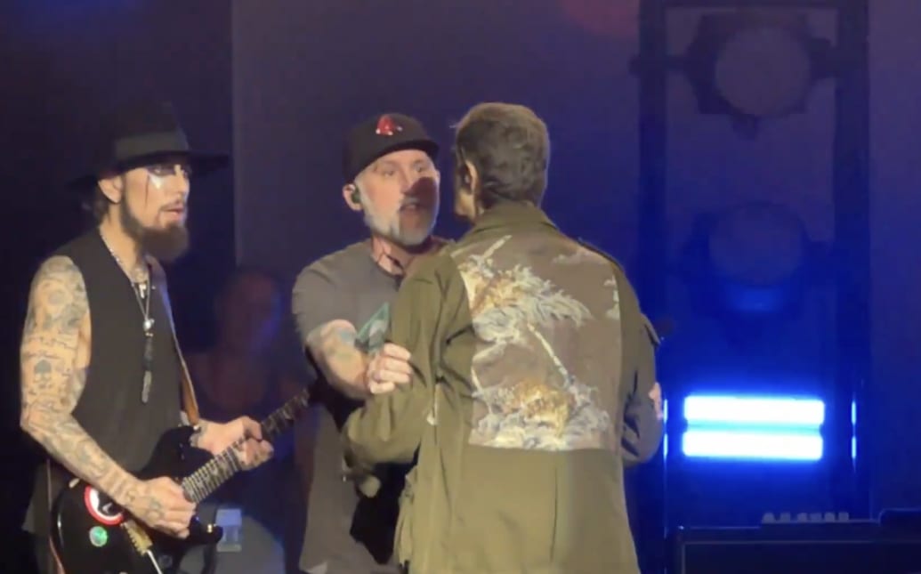 Dave Navarro seems genuinely shocked after Perry Farrell attacked him onstage.