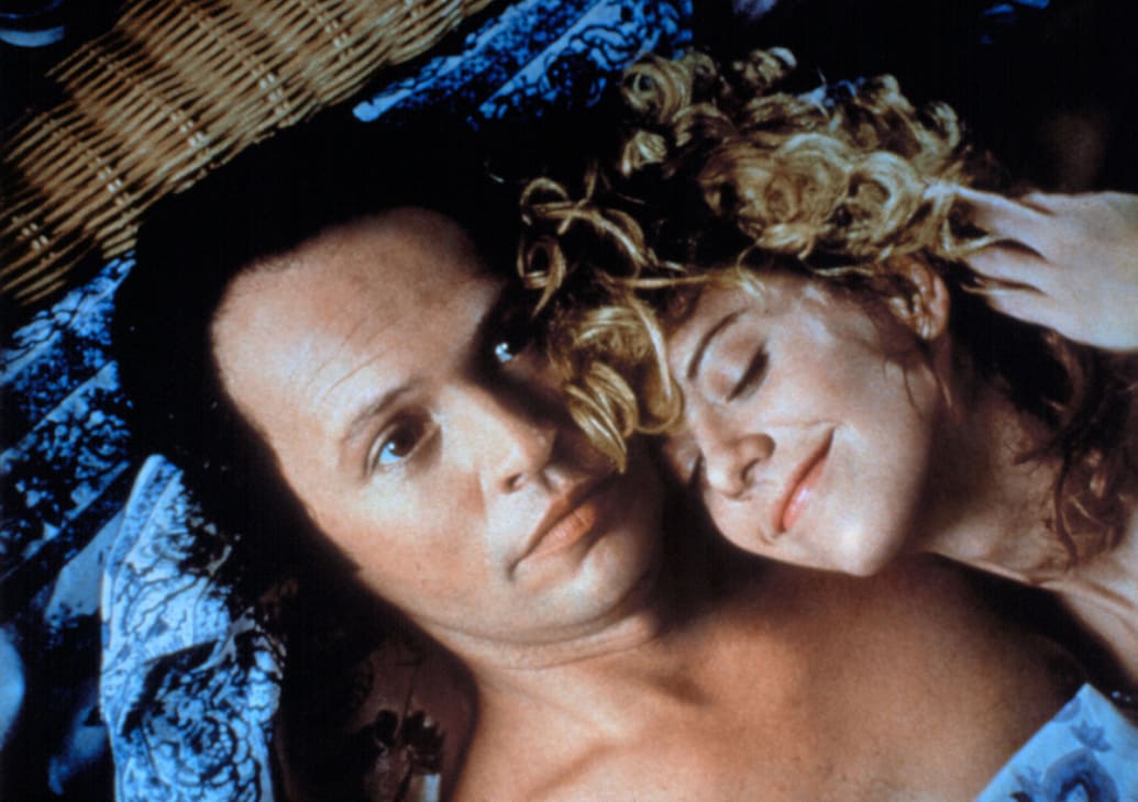 Billy Crystal and Meg Ryan lay in bed in a still from ‘When Harry Met Sally’