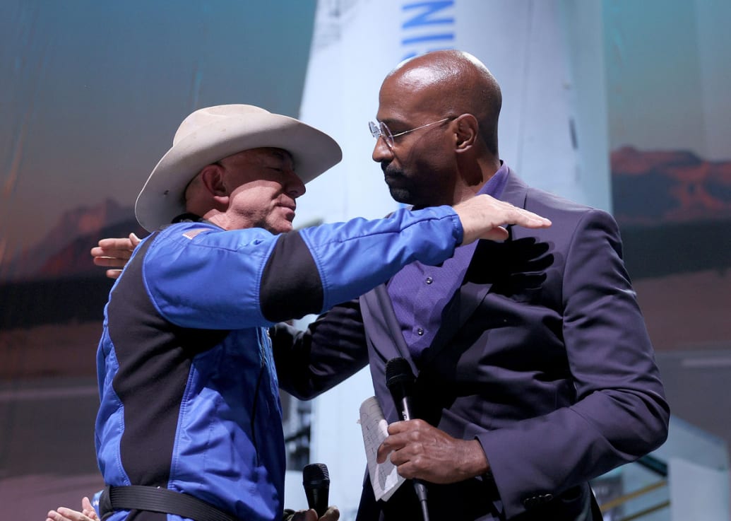 Jeff Bezos hugs Van Jones 