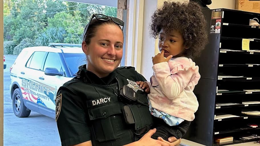 Deputy Kaelin Darcy and the 2-year-old she helped save.
