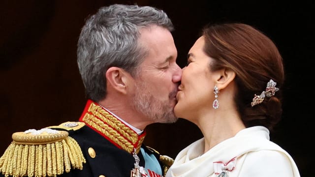 Denmark's newly proclaimed King Frederik and Queen Mary kiss on the balcony of Christiansborg Palace, following the abdication of former Queen Margrethe who reigned for 52 years, in Copenhagen, Denmark, January 14, 2024.