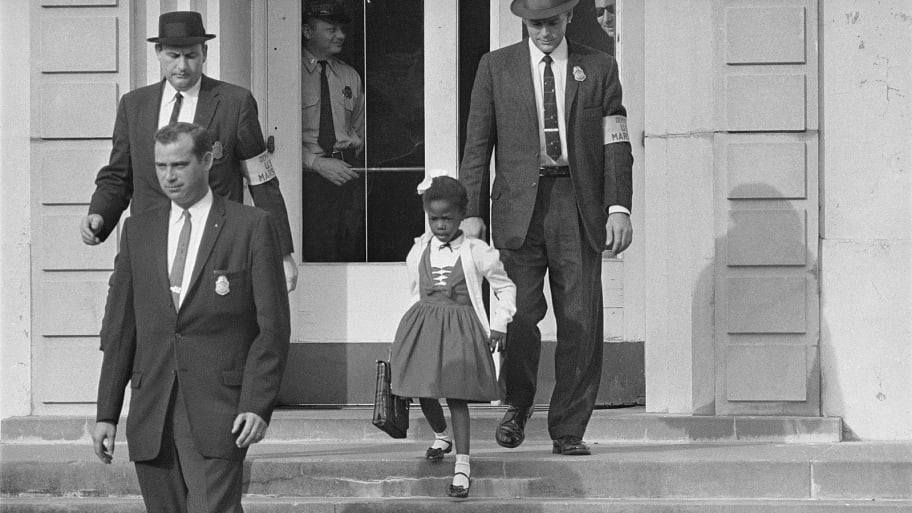 William Frantz Elementary School, New Orleans, 1960. U.S. marshals with young Ruby Bridges on school steps.