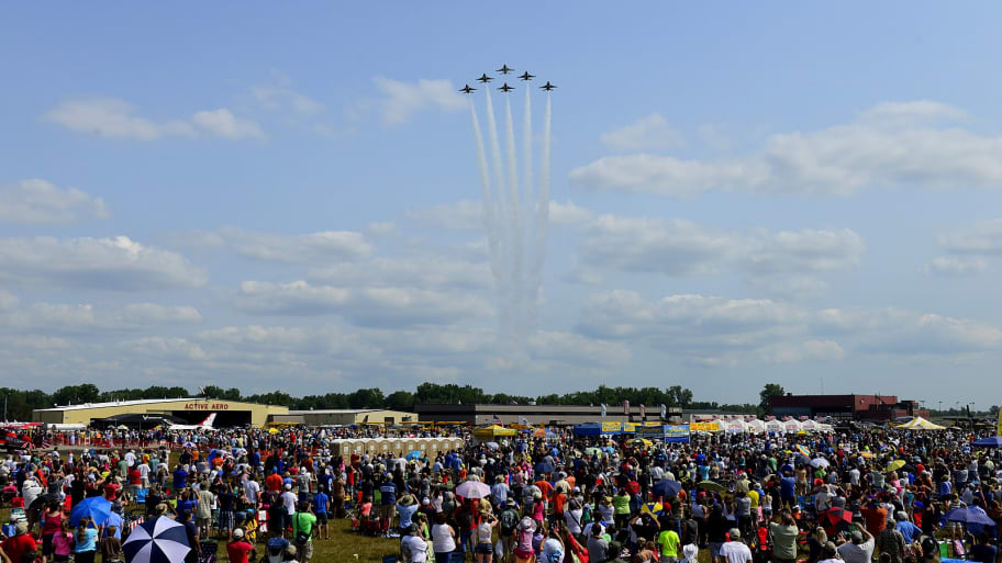 The Thunderbirds Delta Formation pilots flyover a crowd of 45,000 spectators during the Thunder Over Michigan Air Show, in Ypsilanti, Mich. Aug. 9, 2014