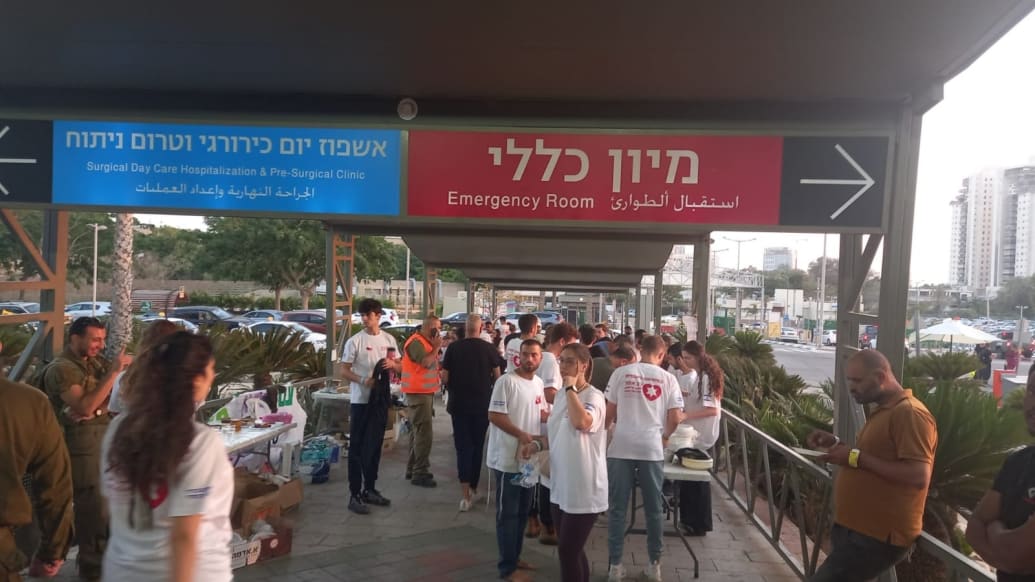 A photo of Israeli volunteers serving free food to first responders, survivors of last weekend’s terror attack, and their families, outside the Soroka Medical Center in Be'er Sheva.
